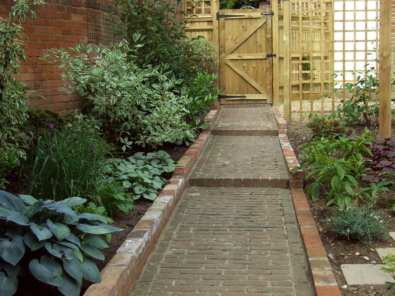 Traditional garden with original brick path to cottage