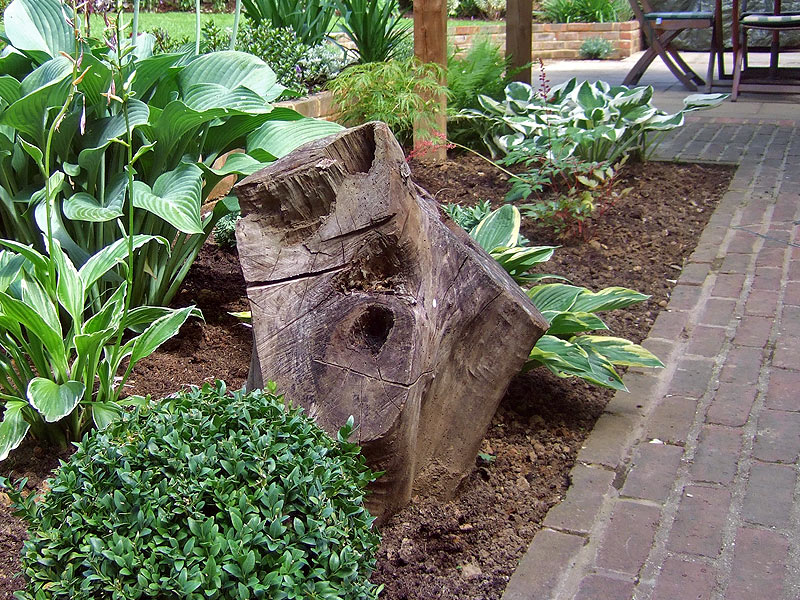 Traditional garden with brick path and shade tolerant planting