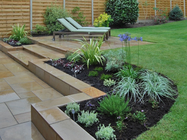 Sawn sandstone paving with bullnose steps