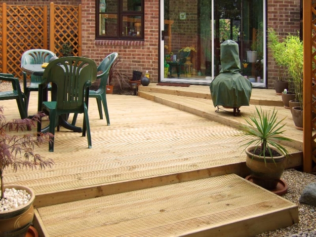 Small garden with decking on different levels