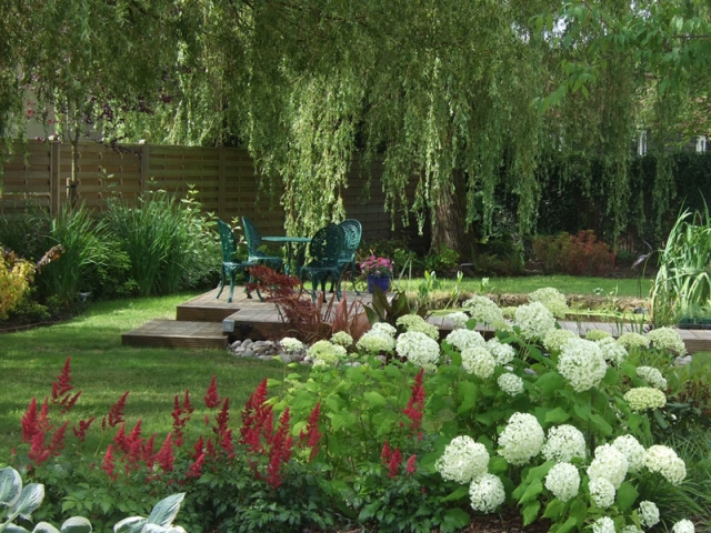 Large country garden with pond and decked seating area