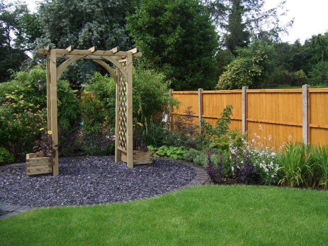 Pergola arch in a slate chipping circle