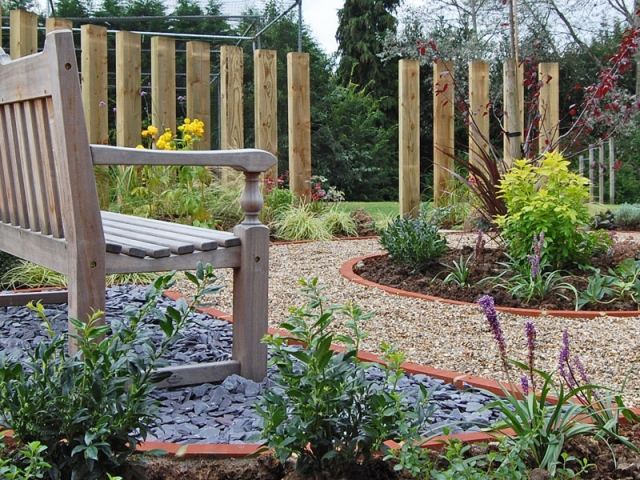 Memorial Garden for School - Circular layout defined by bricks with sleeper screening behind