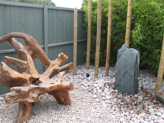 Pebbles and cobbles with slate monolith and bamboo