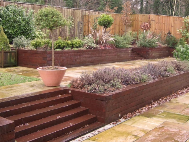 Terraces with painted sleeper walls and steps