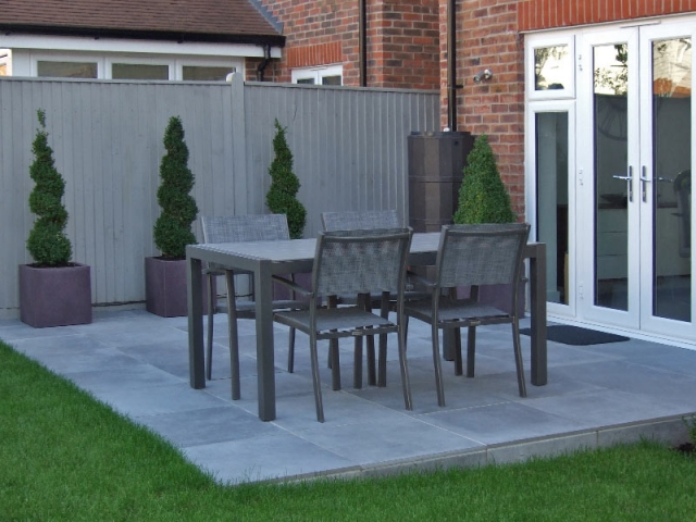 Porcelain paved dining area with topiary box spirals