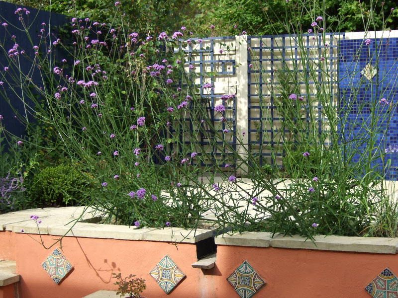 Moroccan Courtyard Garden with blue tiled feature wall and central rill