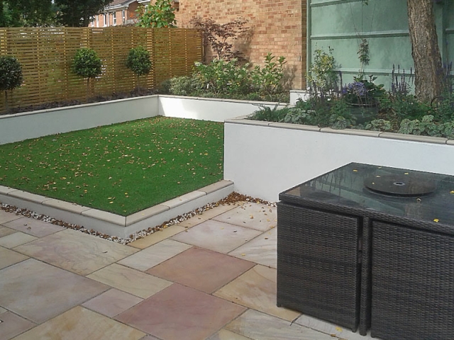 Contemporay garden with different levels and artificial grass