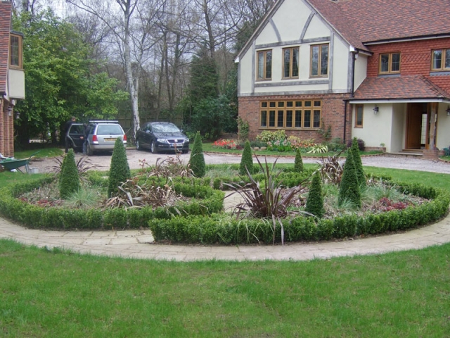 Geometric circular formation with box edging and cones.