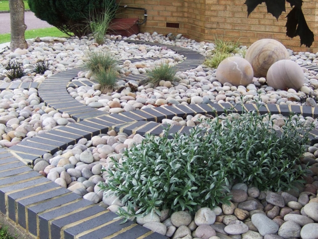 Front Garden with curving brick motif and cobbles