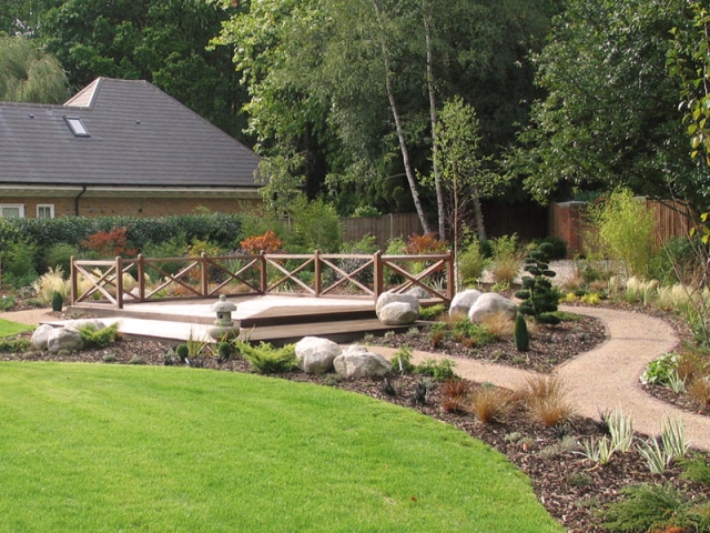 Japanese themed garden with large deck