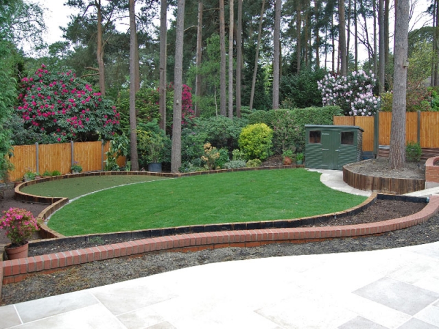 Sleeper terraces create level lawns on this sloping plot