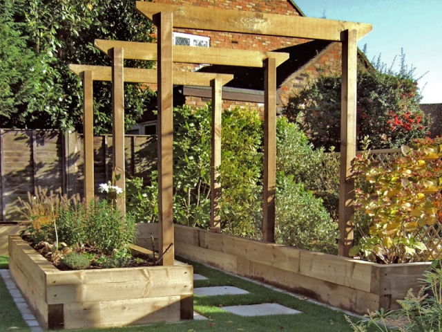 Timber arches between sleeper raised beds