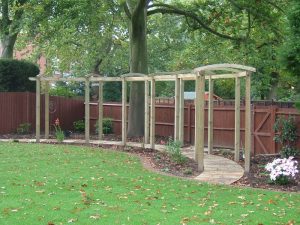 Bow-topped pergola over curving walkway
