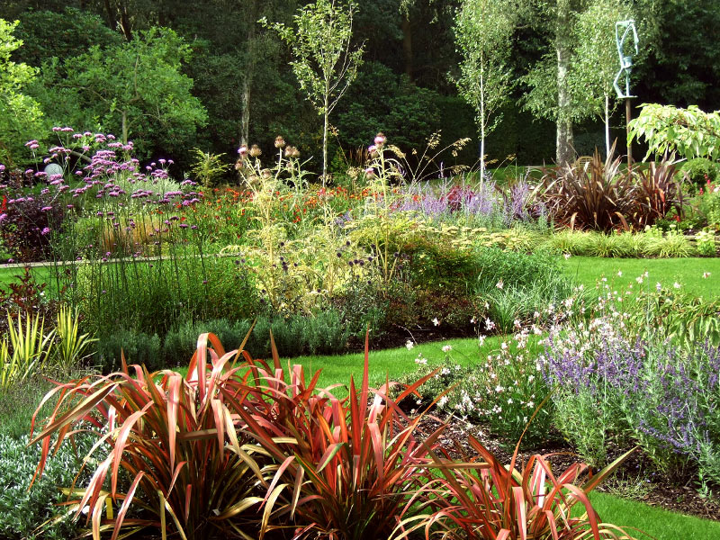 Large mixed borders with bold swathes of colour