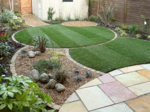 Small garden with circular lawn and seating areas