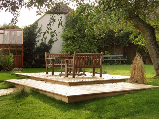 Split level decking under an old apple tree