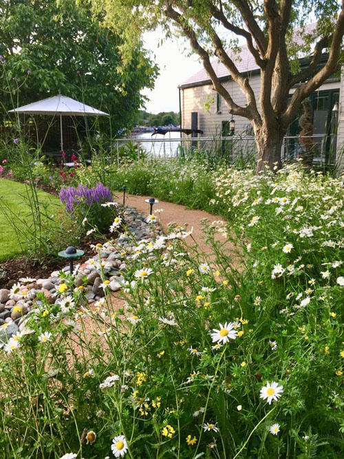 Resin path to a houseboat in the summer